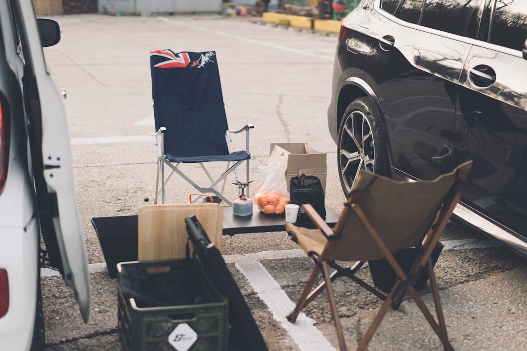 A compact cooler with sealed gaskets and sturdy latches on a camping picnic table
