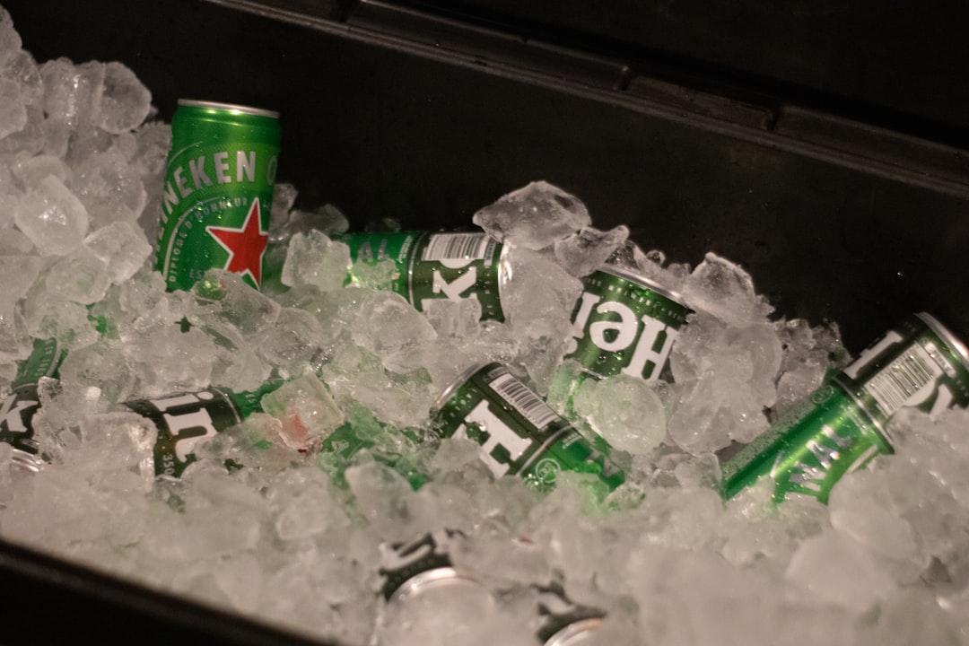 Cooler being packed with ice and food items for a camping trip