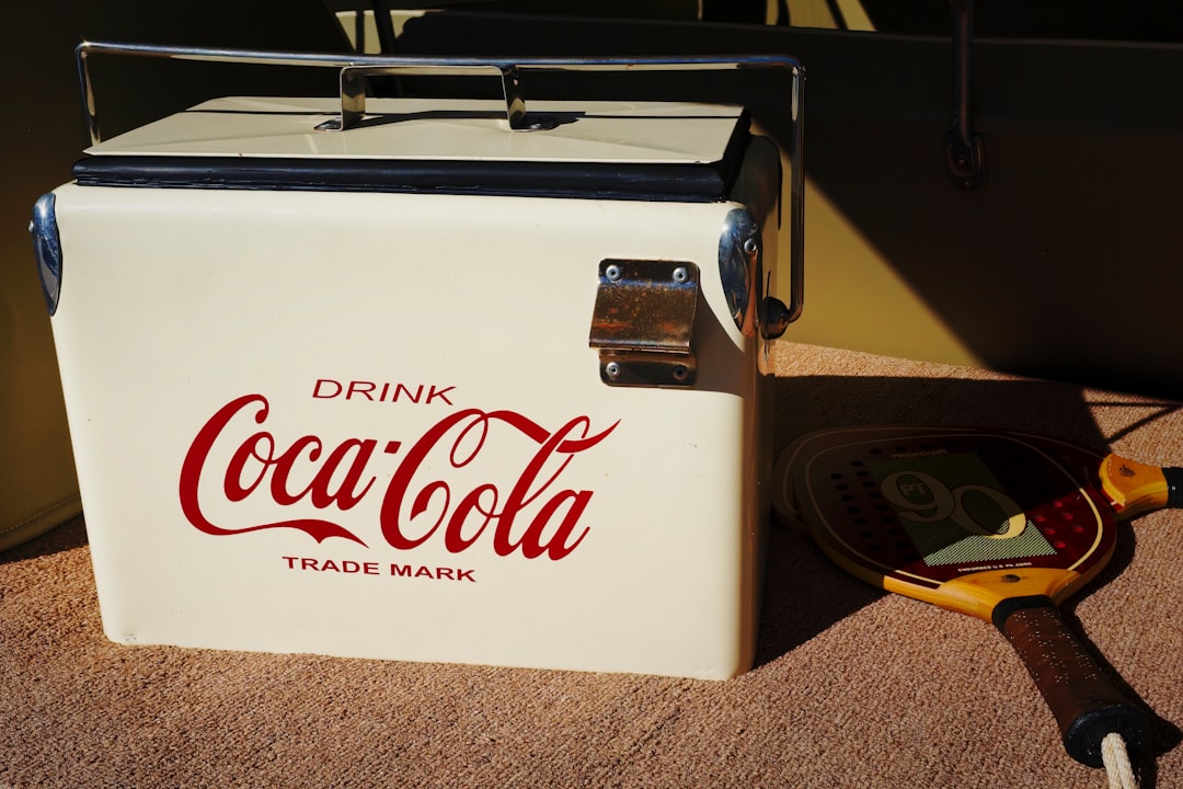 Electric cooler with digital display open in a campsite setting